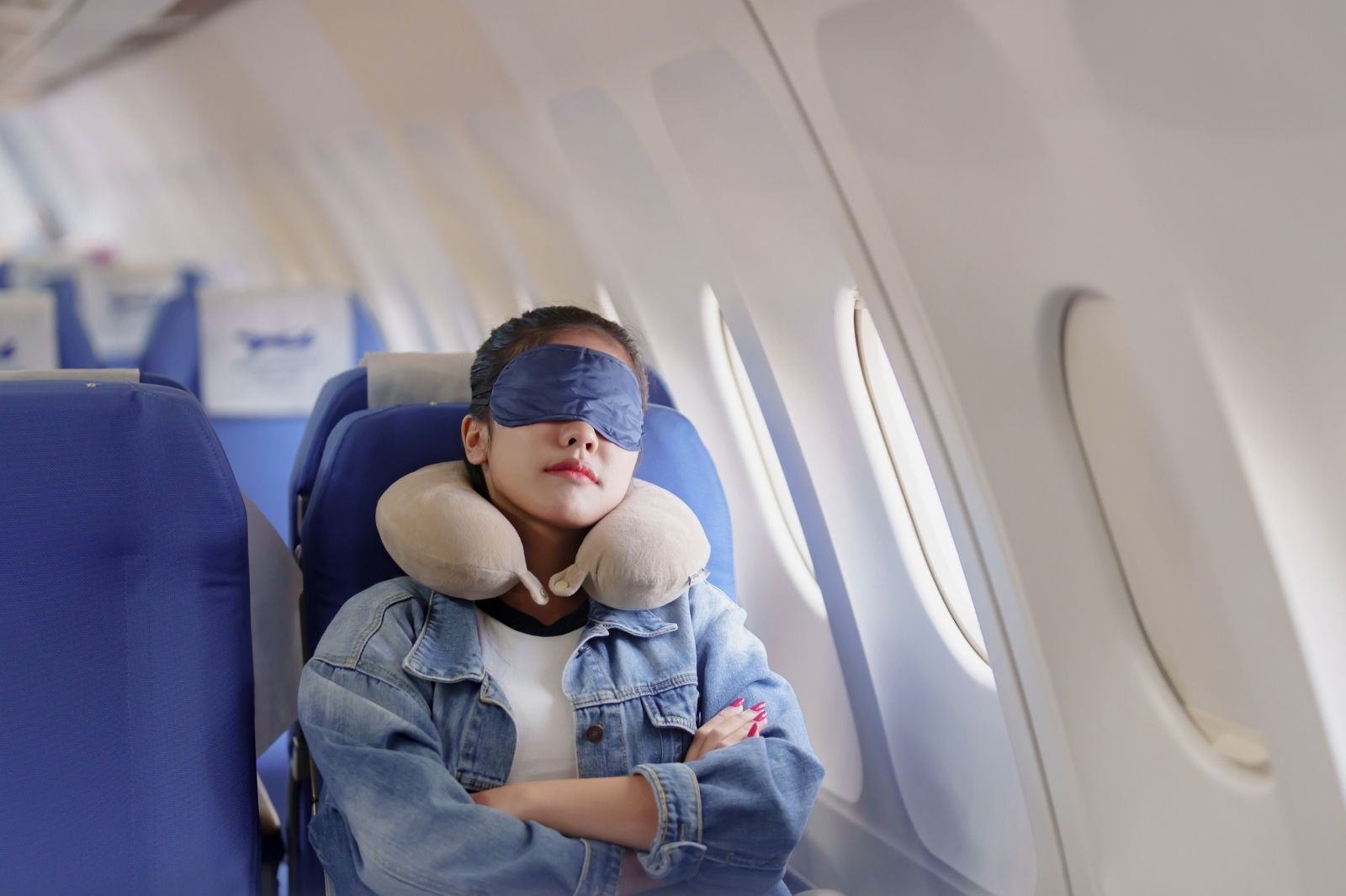 woman sleeping on plane